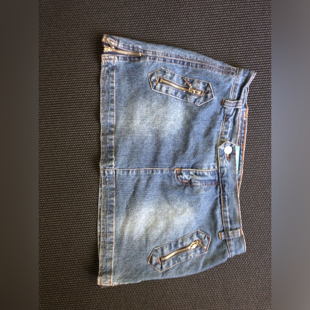 Denim mini skirt with detailed zippers